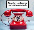 Foto: Rotes Telefon mit Wählscheibe und der Überschrift: Telefonseelsorge der LVR.Frida-Kahlo-Schule