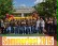Das Foto zeigt eine große Gruppe von UPS-Mitarbeitern vor einer Hüpfburg und den Schriftzug Sommerfest 2015.